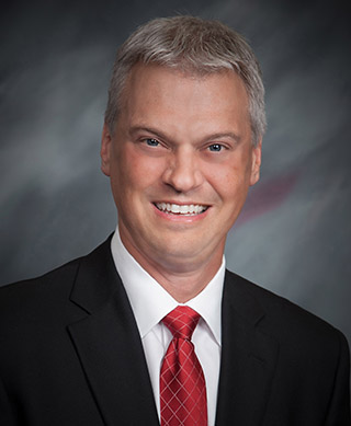 Craig Aman, President and CEO